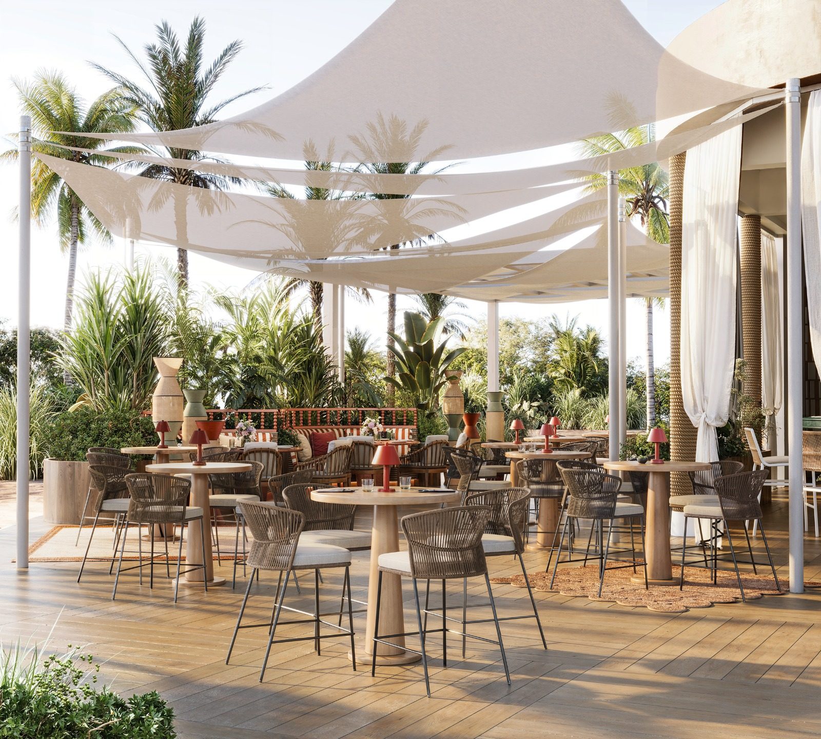 Terrace tables under sail shades